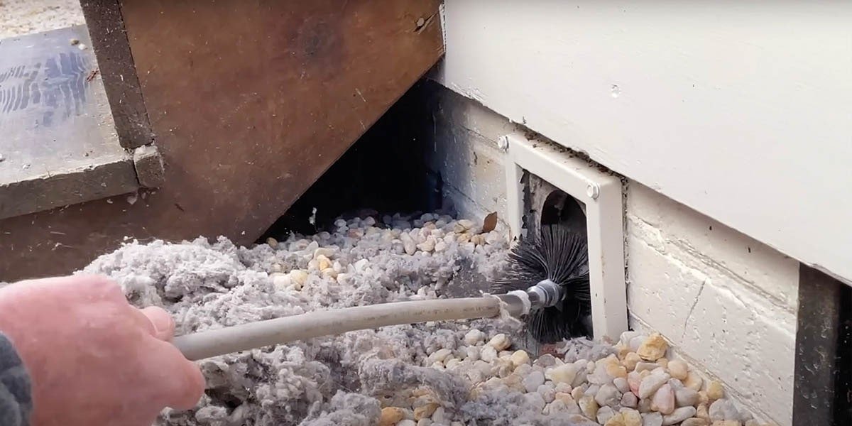 Professional dryer vent cleaning in New Braunfels residence, using our 4" rotating brush